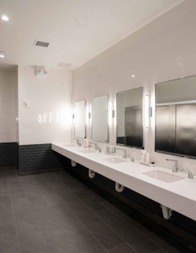 A bathroom with sinks and mirrors.