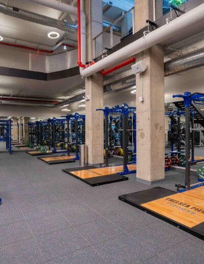 A gym with a lot of equipment in it.