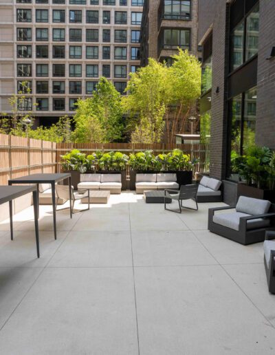 A patio with a table and chairs.