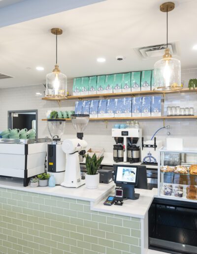 A coffee shop with a green tiled counter.